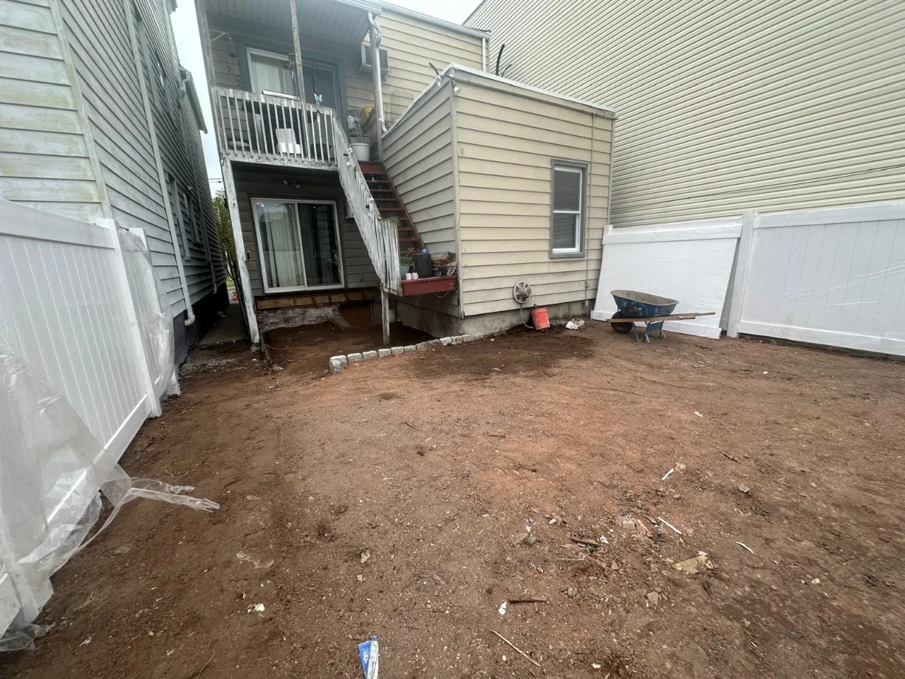 Cracked concrete driveway in New Jersey being inspected for repair
